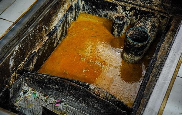 delaying grease trap cleaning can lead to foul odors, sanitation concerns, and expensive repairs